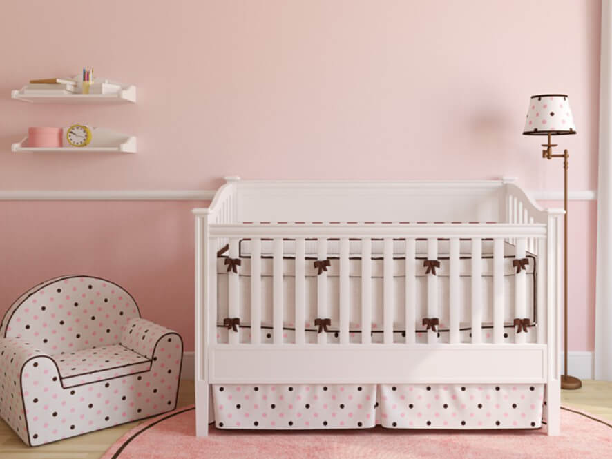 Pretty_in_Pink_Nursery_White_Cot_Ribbons_Polka_Dot_Chair_White_Shelves_timber_Lamp_Fluffy_Rug